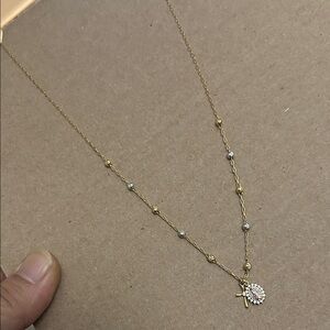 Elegant Gold and Silver Necklace with Cross Pendant